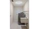 Bright laundry room equipped with a modern washer and dryer, a utility sink, and ample storage space at 4655 Payne St, North Port, FL 34287