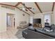 Inviting living room features vaulted ceilings, wood beams, and stylish flooring at 4655 Payne St, North Port, FL 34287