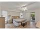 Inviting primary bedroom featuring neutral colors, tile flooring, sliding glass doors, and modern furniture at 4655 Payne St, North Port, FL 34287