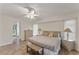 Comfortable bedroom with tile flooring, neutral paint, and a large window allowing natural light at 4655 Payne St, North Port, FL 34287