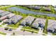 Aerial view of homes in a well-maintained community with pond at 4711 Cedron Ct, Sarasota, FL 34240