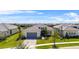 Stunning aerial view of a home featuring a tile roof, paver driveway, and well-kept landscaping at 4711 Cedron Ct, Sarasota, FL 34240
