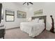 Calm bedroom featuring carpet, a large window, and soft, cozy white linens at 4711 Cedron Ct, Sarasota, FL 34240