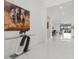 Bright foyer with modern art and an open view to the dining and living areas at 4711 Cedron Ct, Sarasota, FL 34240