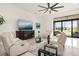 Spacious living room with a large flat-screen TV and comfortable seating at 4711 Cedron Ct, Sarasota, FL 34240