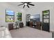 Well-lit office space with modern furniture, ample storage, and views of the outside at 4711 Cedron Ct, Sarasota, FL 34240