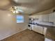 Functional kitchen with white cabinets and appliances, featuring a window for natural light at 4712 Cronin Dr, Sarasota, FL 34232