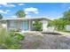 Charming single-story home showcasing its freshly painted exterior and well-maintained landscaping at 4801 Sarasota Ave, Sarasota, FL 34234