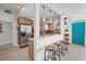 Stylish kitchen with stainless steel appliances, breakfast bar seating and access to the front entrance at 4801 Sarasota Ave, Sarasota, FL 34234