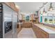 Modern kitchen boasts sleek wooden cabinets, stainless steel appliances, and ample counter space at 4801 Sarasota Ave, Sarasota, FL 34234
