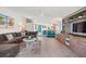 Spacious living area featuring a sectional sofa, stylish decor, and an open flow to other living spaces at 4801 Sarasota Ave, Sarasota, FL 34234