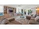 Bright living room with modern decor, built-in shelving, and access to an outdoor area at 4801 Sarasota Ave, Sarasota, FL 34234