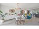 Open-concept living and dining room with lots of natural light and modern furnishings at 4801 Sarasota Ave, Sarasota, FL 34234