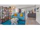 Inviting living room featuring a comfortable blue sofa, stylish decor, and an open layout at 4801 Sarasota Ave, Sarasota, FL 34234
