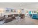 Open-concept living room with modern furnishings, stylish decor, and a view into the kitchen at 4801 Sarasota Ave, Sarasota, FL 34234
