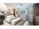 Bright bedroom features neutral decor, including neutral carpeting, a built-in storage, and an exterior view at 4806 Capri Ave, Sarasota, FL 34235