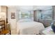 Comfortable bedroom featuring bright natural light, built in wardrobe, and cool-tone color scheme at 4806 Capri Ave, Sarasota, FL 34235