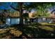 Charming single-story home with a well-manicured lawn and mature tree offering plenty of shade at 4806 Capri Ave, Sarasota, FL 34235