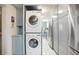 Convenient laundry area with modern appliances and storage cabinets at 4806 Capri Ave, Sarasota, FL 34235