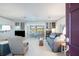 Bright and airy living room with built-in shelving and a seamless flow to the outdoor dining area at 4806 Capri Ave, Sarasota, FL 34235