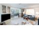 Bright and airy living room with built-in shelving and a seamless flow to the outdoor dining area at 4806 Capri Ave, Sarasota, FL 34235
