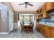 Bright dining room with wood table, bay window, and custom cabinetry, ideal for Gathering meals at 5607 78Th E Ave, Palmetto, FL 34221