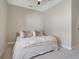 Bedroom featuring a comfortable bed with decorative pillows and a carpeted floor at 5673 Piccolo St, Nokomis, FL 34275