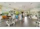 Well-equipped gym with mirrored walls, various exercise machines, weights, and fitness accessories at 5673 Piccolo St, Nokomis, FL 34275