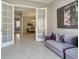 Living room with a comfortable couch, views of the dining room, and lots of natural light at 5673 Piccolo St, Nokomis, FL 34275