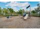 Community playground with slides, climbing structures, and safety ground cover at 5673 Piccolo St, Nokomis, FL 34275