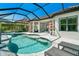 Inviting pool area featuring a spa, covered patio, and comfortable seating arrangements at 5673 Piccolo St, Nokomis, FL 34275