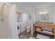 Updated bathroom with tiled walk-in shower and stylish granite vanity at 5766 Forester Pine Ct, Sarasota, FL 34243