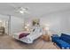 Comfortable bedroom with ceiling fan and access to the adjoining bath at 5766 Forester Pine Ct, Sarasota, FL 34243