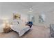 Spacious bedroom with a ceiling fan, natural light, and neutral décor at 5766 Forester Pine Ct, Sarasota, FL 34243