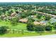 Aerial view showcases the community's layout, lush landscaping, and recreational amenities at 5767 Avista Dr # 5767, Sarasota, FL 34243