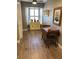 Cozy dining area with hardwood floors, bay window, and cute built-in storage and decor at 5767 Avista Dr # 5767, Sarasota, FL 34243