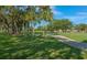 Scenic view of a beautiful green golf course with a path and mature trees at 5767 Avista Dr # 5767, Sarasota, FL 34243
