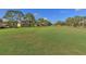 Scenic view of the lush golf course with mature trees and well-maintained greens at 5767 Avista Dr # 5767, Sarasota, FL 34243