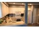Bright kitchen featuring white cabinets, countertops, modern appliances, and a breakfast bar at 5767 Avista Dr # 5767, Sarasota, FL 34243