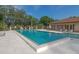 Refreshing community pool with ample lounging space and beautiful landscaping at 5767 Avista Dr # 5767, Sarasota, FL 34243