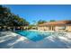 Inviting community pool surrounded by lounge chairs and lush greenery at 5767 Avista Dr # 5767, Sarasota, FL 34243