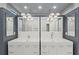 Contemporary bathroom boasts double sink vanity with modern fixtures and stylish pendant lighting at 5838 Meriwether Pl, Sarasota, FL 34232