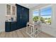 Stylish kitchen with breakfast nook, modern cabinetry, and natural light from a large window at 605 Sutton Pl # 401-A, Longboat Key, FL 34228