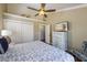 Bedroom with coastal decor, closet, and TV on a painted white dresser at 612 Fern St, Anna Maria, FL 34216