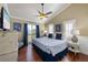 Inviting bedroom with balcony access, hardwood floors, and coastal-themed accents at 612 Fern St, Anna Maria, FL 34216
