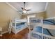 Bedroom with hardwood floors and a set of two bunk beds for the  at 612 Fern St, Anna Maria, FL 34216