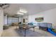 Versatile game room features a ping pong table and ample space for recreational activities and storage at 612 Fern St, Anna Maria, FL 34216