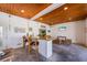 Outdoor bar area with seating, TV, and bar games for casual conversation and entertainment with friends and Gathering at 612 Fern St, Anna Maria, FL 34216
