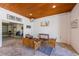 Comfortable outdoor lounge area with a TV, providing a relaxing space for entertainment and gatherings at 612 Fern St, Anna Maria, FL 34216