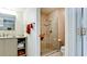 A bathroom featuring a glass-enclosed tiled shower, vanity, and neutral color palette at 631 Woodlawn Dr, Bradenton, FL 34210